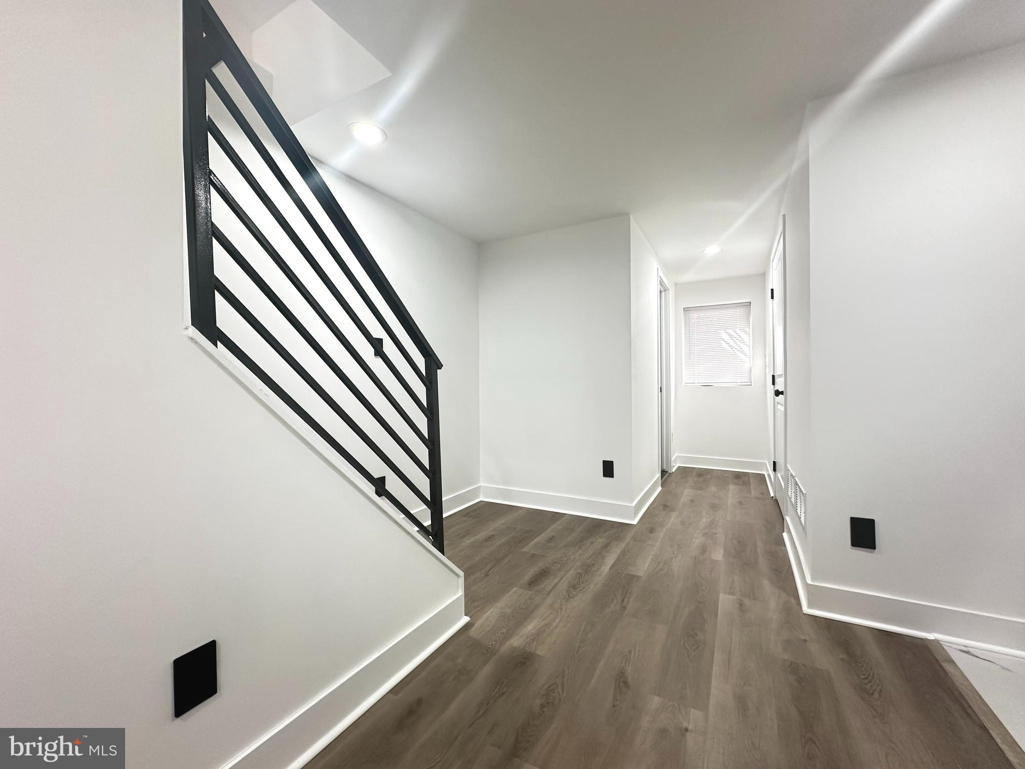 1015 South 6th Street, Unit 1 Philadelphia, PA 19147 - Photo 17 of 18 an entryway in a hall with wooden floor