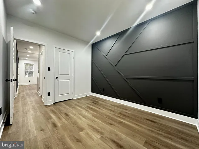 a view of a livingroom with wooden floor