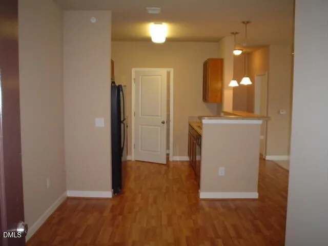 a kitchen with granite countertop stainless steel appliances and wooden cabinets