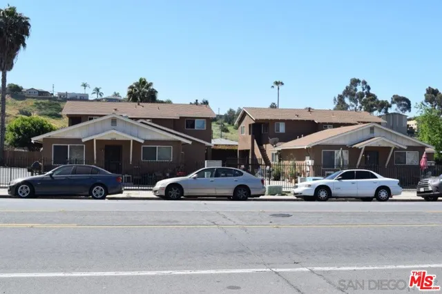 a view of a cars parked in front of a house