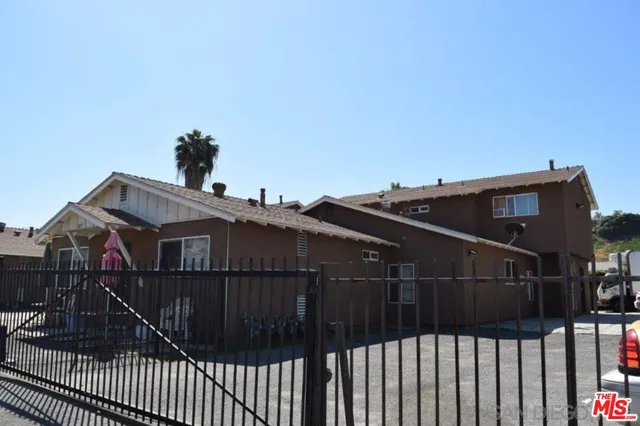 a view of buildings from the balcony