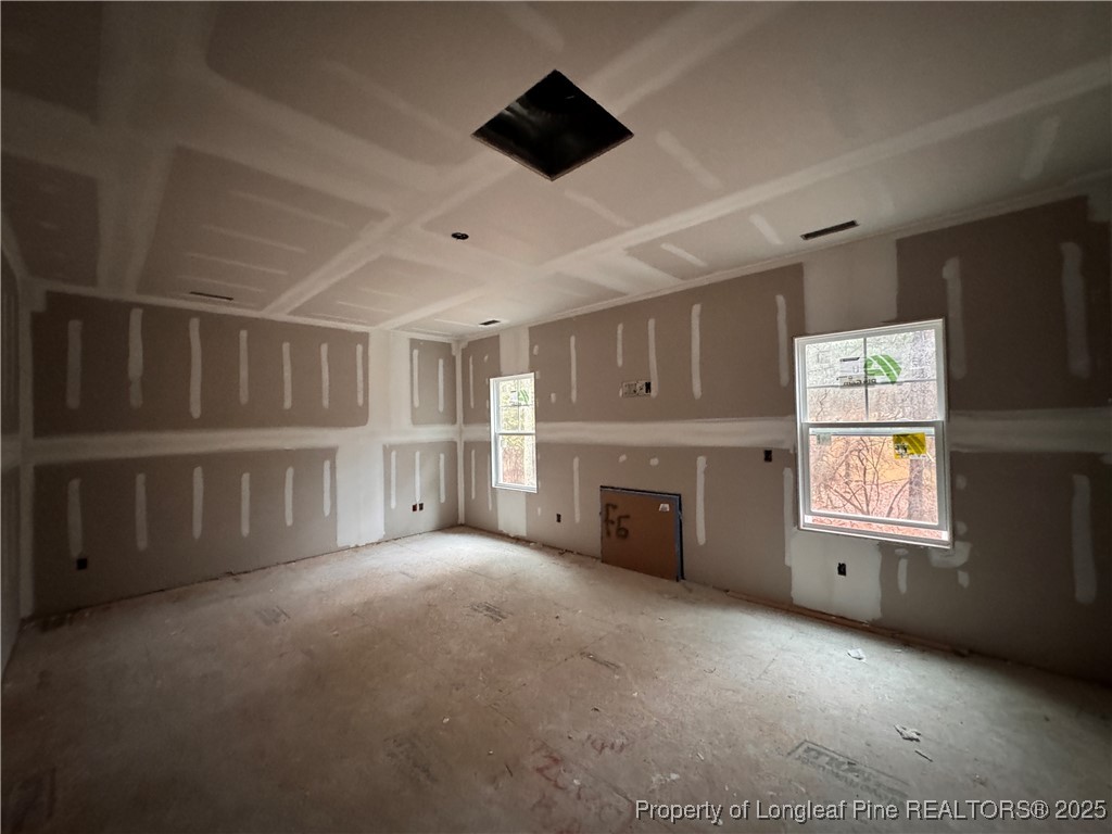 428 Redwater Trail Aberdeen, NC 28315 - Photo 11 of 48 a view of an empty room with a fireplace and a window
