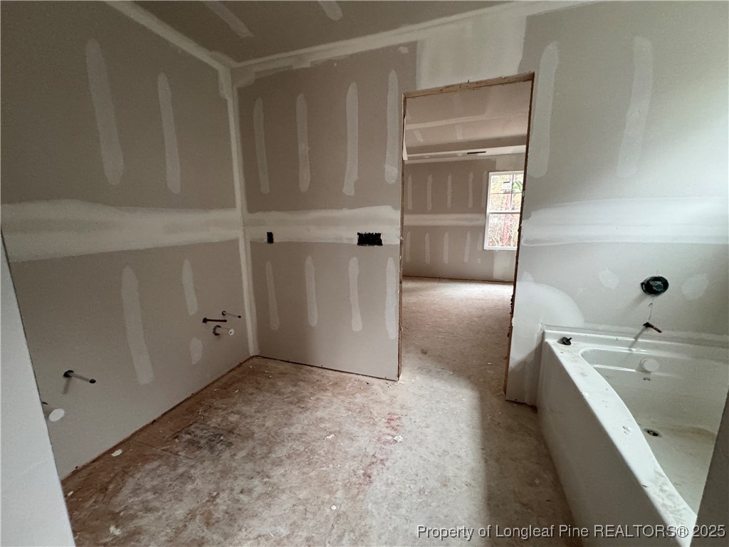 428 Redwater Trail Aberdeen, NC 28315 - Photo 26 of 48 a bathroom with a bathtub and a sink