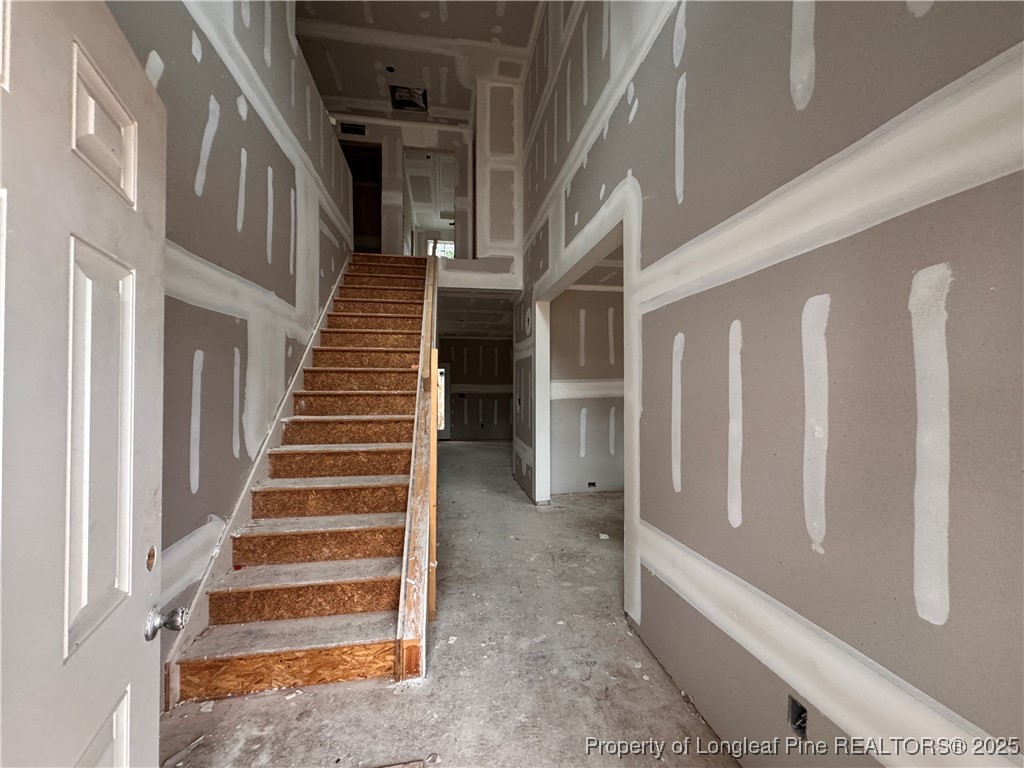 428 Redwater Trail Aberdeen, NC 28315 - Photo 4 of 48 a view of an entryway with staircase