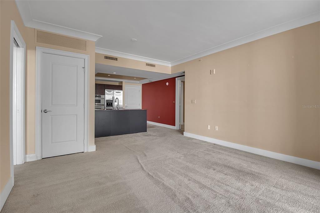 1350 Main Street, Unit 707 Sarasota, FL 34236 - Photo 22 of 68 a view of an empty room and kitchen