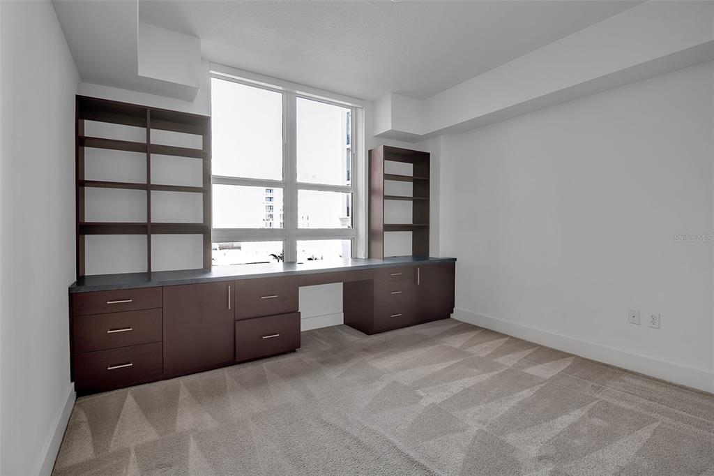 1350 Main Street, Unit 707 Sarasota, FL 34236 - Photo 24 of 68 a room with a bed and a window