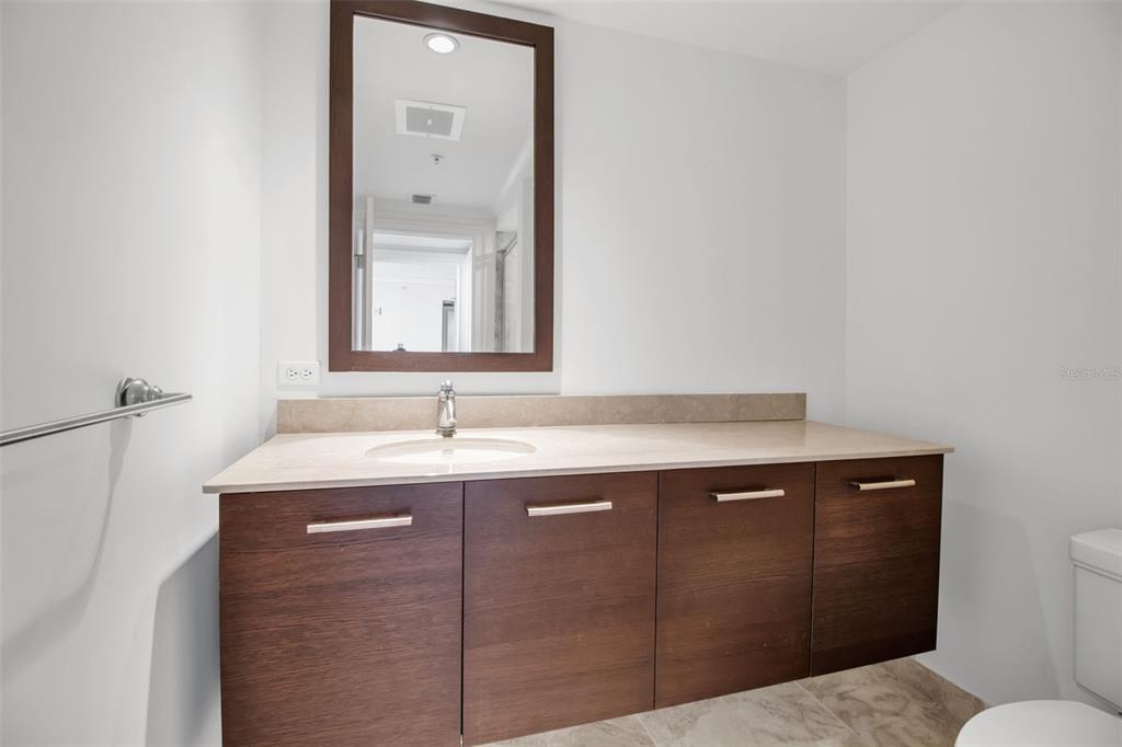 1350 Main Street, Unit 707 Sarasota, FL 34236 - Photo 29 of 68 a bathroom with a sink and a mirror