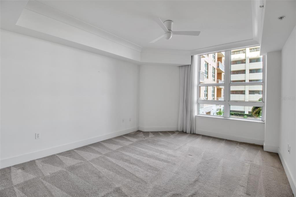 1350 Main Street, Unit 707 Sarasota, FL 34236 - Photo 31 of 68 wooden floor in an empty room with a window