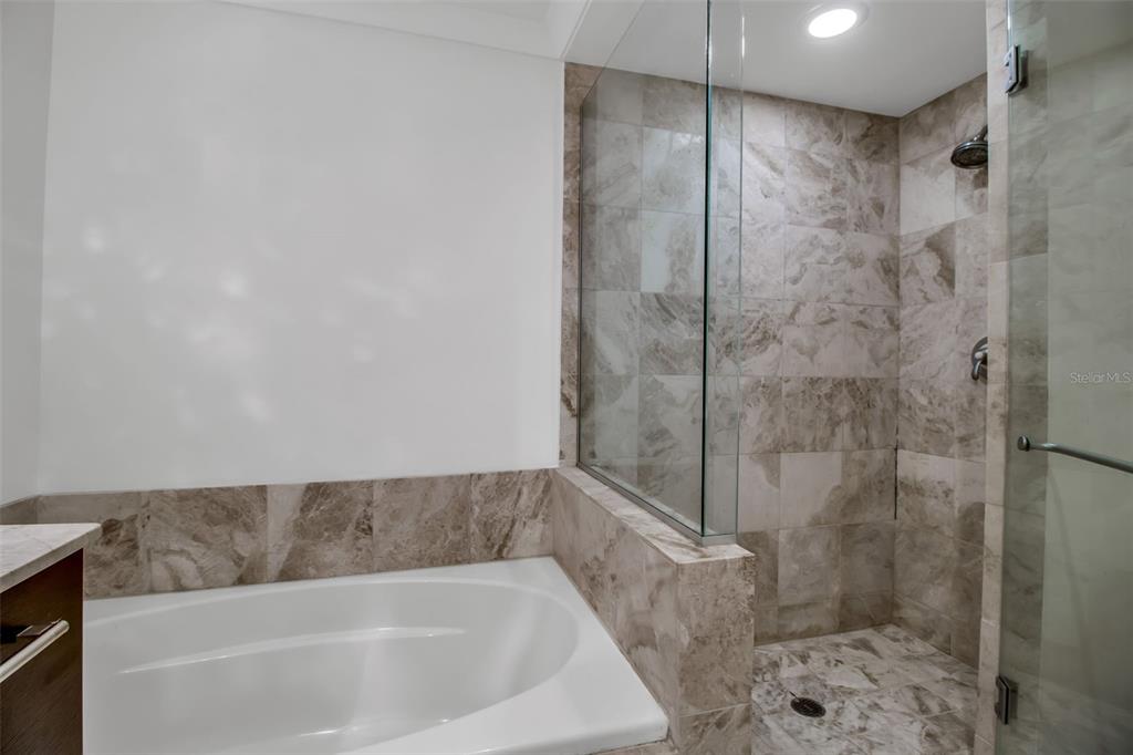 1350 Main Street, Unit 707 Sarasota, FL 34236 - Photo 36 of 68 a bathroom with a bathtub and shower