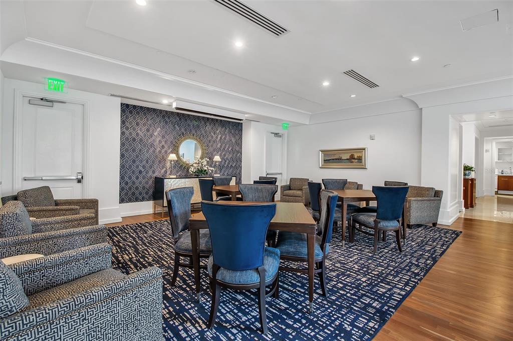 1350 Main Street, Unit 707 Sarasota, FL 34236 - Photo 53 of 68 a living room with furniture potted plant and kitchen view
