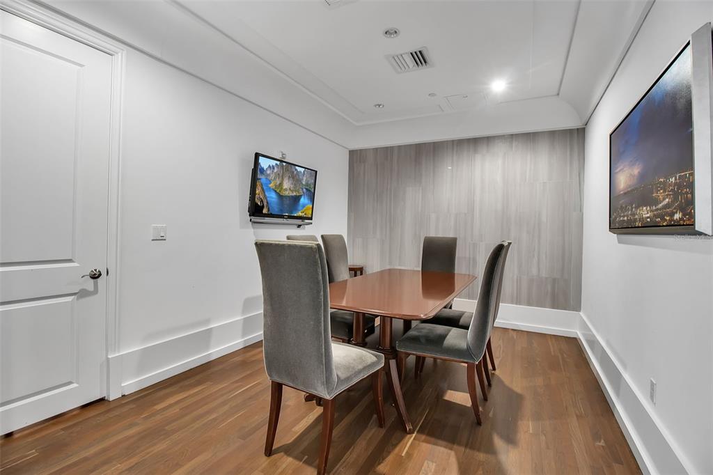 1350 Main Street, Unit 707 Sarasota, FL 34236 - Photo 55 of 68 a view of a dining room with furniture and wooden floor