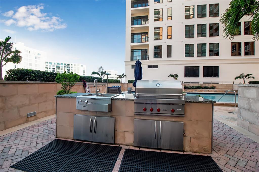 1350 Main Street, Unit 707 Sarasota, FL 34236 - Photo 62 of 68 a kitchen with a stove and a microwave