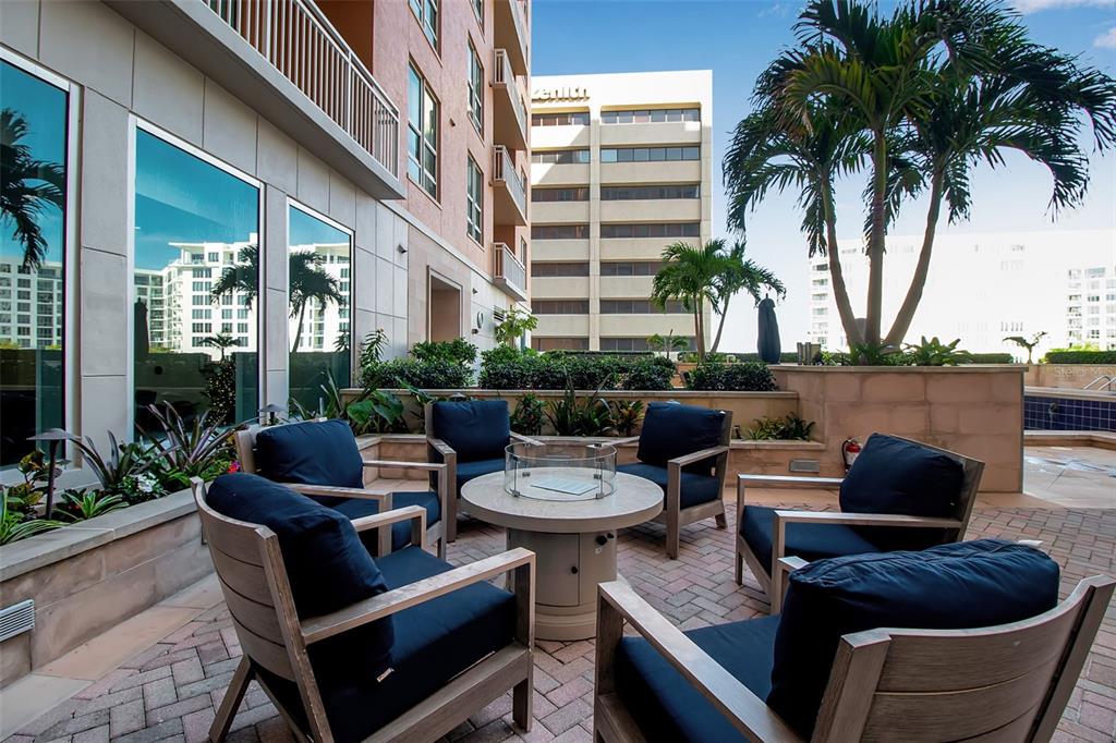 1350 Main Street, Unit 707 Sarasota, FL 34236 - Photo 64 of 68 a view of a patio with couches chairs and a potted plant