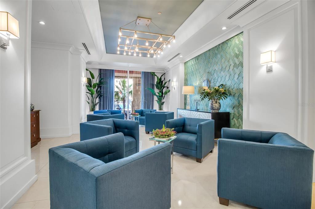 1350 Main Street, Unit 707 Sarasota, FL 34236 - Photo 65 of 68 a living room with furniture and a chandelier