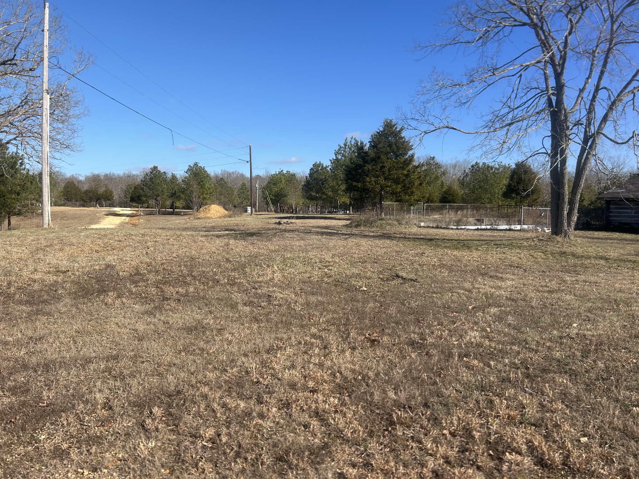 0 Deerwood Run Big Sandy, TN 38221 - Photo 7 of 7 a view of dirt field and trees
