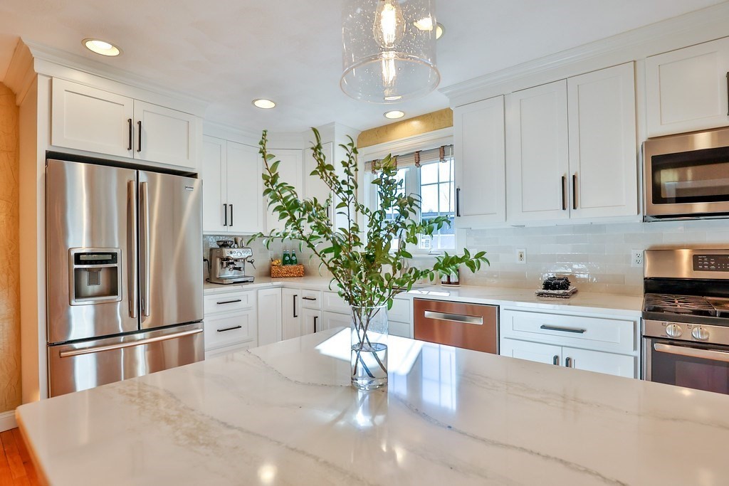 2 Estey Road North Billerica, MA 01862 - Photo 8 of 36 a kitchen with stainless steel appliances a refrigerator sink and cabinets