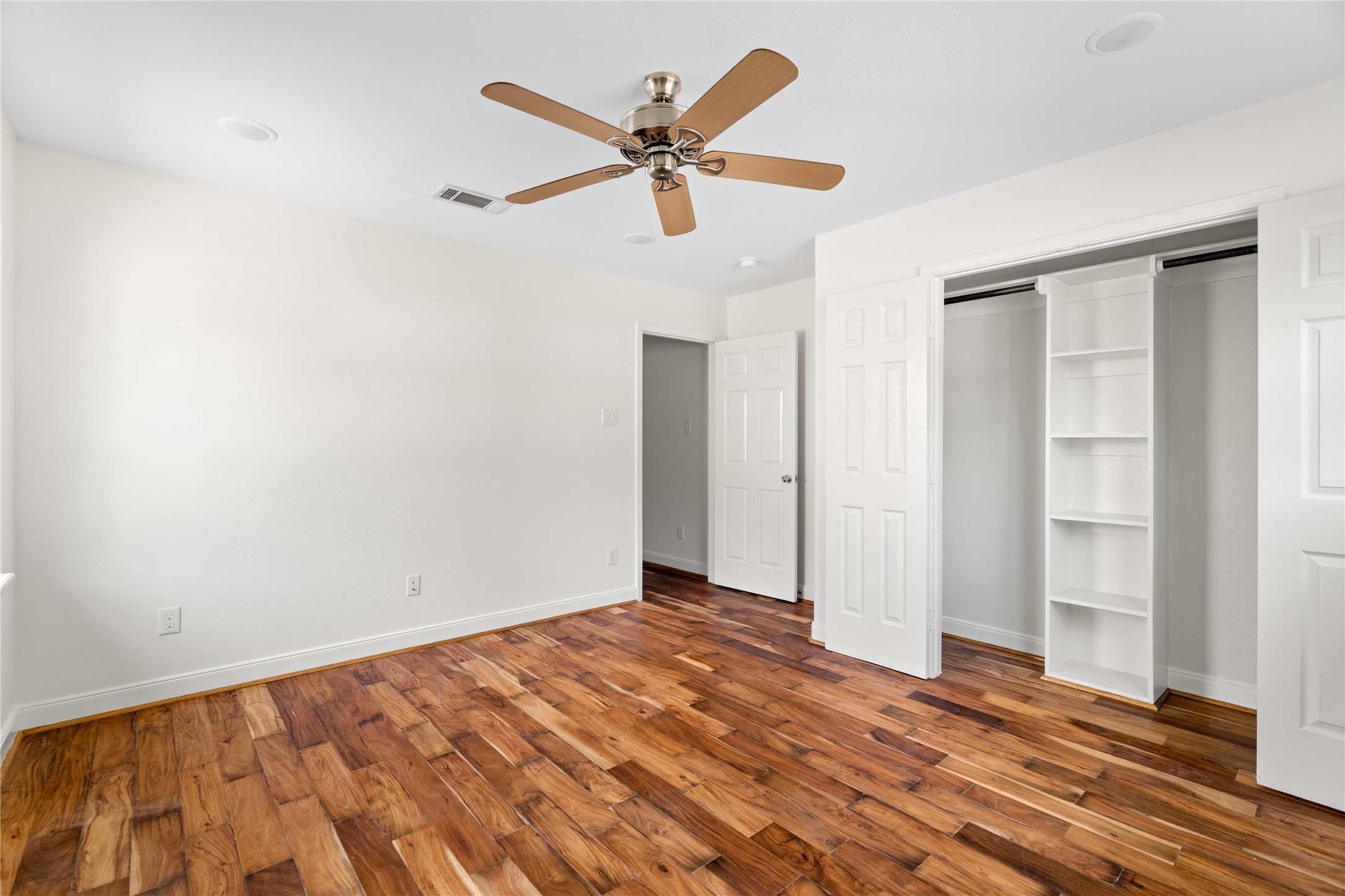 5515 Warm Springs Road Houston, TX 77035 - Photo 14 of 19 a view of empty room with wooden floor