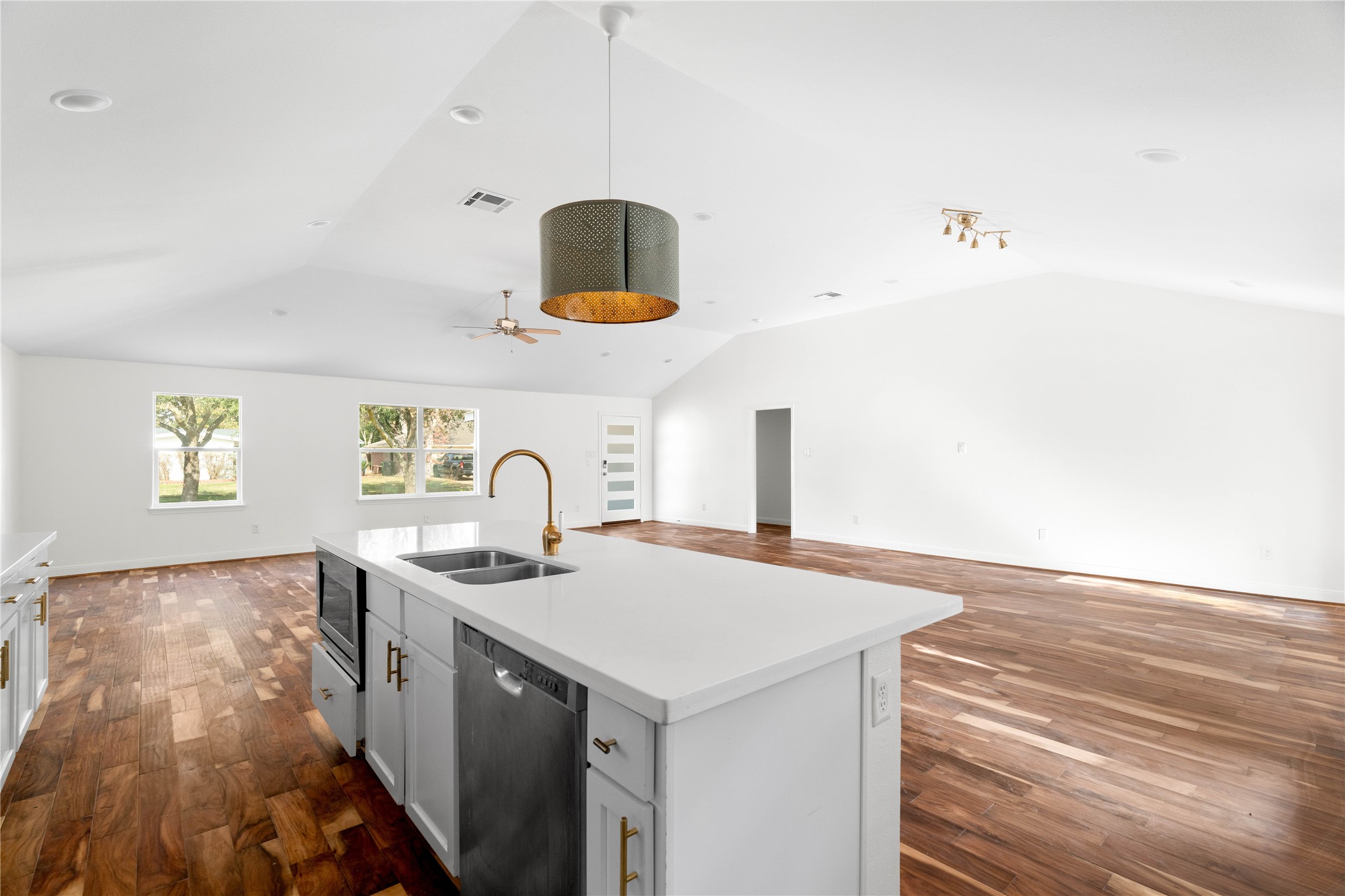 5515 Warm Springs Road Houston, TX 77035 - Photo 3 of 19 a kitchen with a sink a stove and a microwave