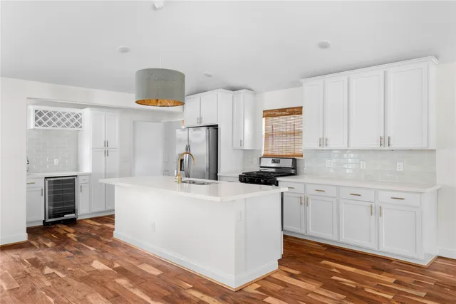 a kitchen that has a sink and a stove