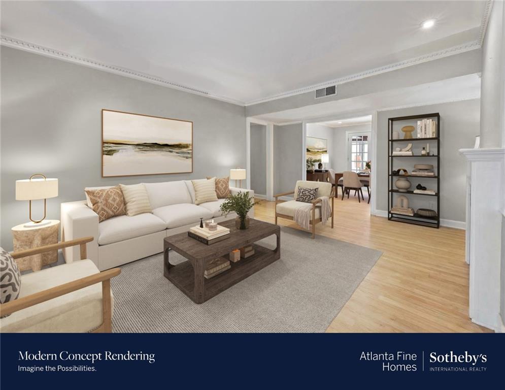a living room with furniture and a wooden floor