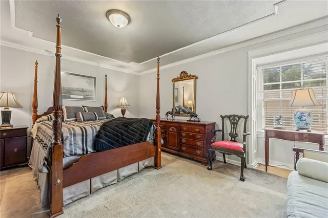 a bedroom with furniture and a window