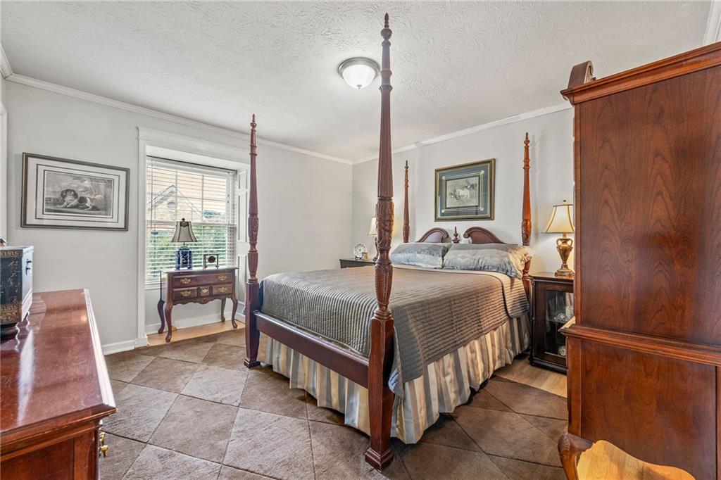 3825 Lavista Road, Unit Y3 Tucker, GA 30084 - Photo 14 of 24 a bed room with a bed and a chair