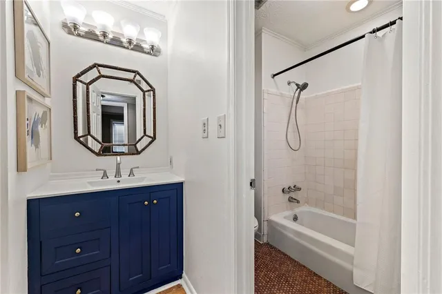 a bathroom with a bathtub sink mirror and vanity