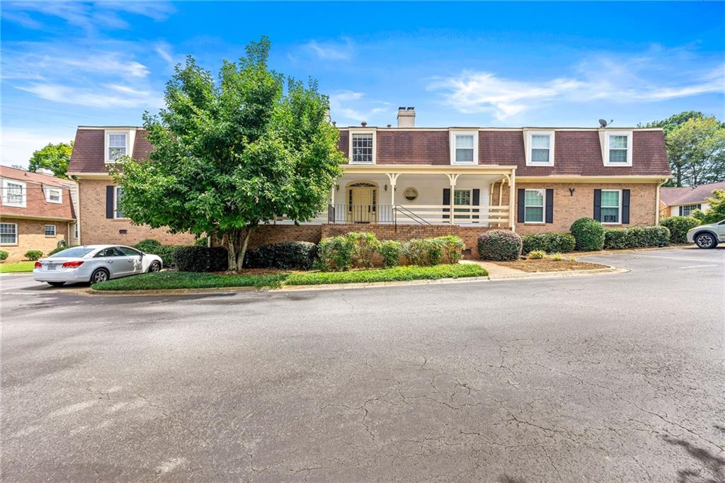 3825 Lavista Road, Unit Y3 Tucker, GA 30084 - Photo 17 of 24 a front view of a house with a yard and a garage