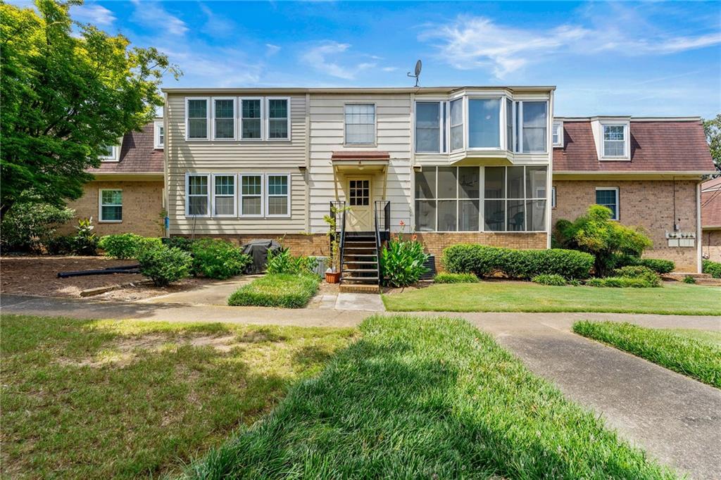3825 Lavista Road, Unit Y3 Tucker, GA 30084 - Photo 18 of 24 front view of a house with a yard