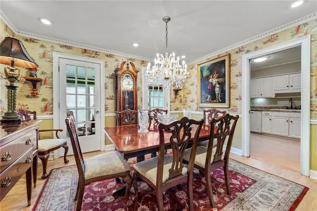 a view of a dining room with furniture and window