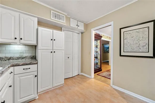 a view of cabinets with wooden floor