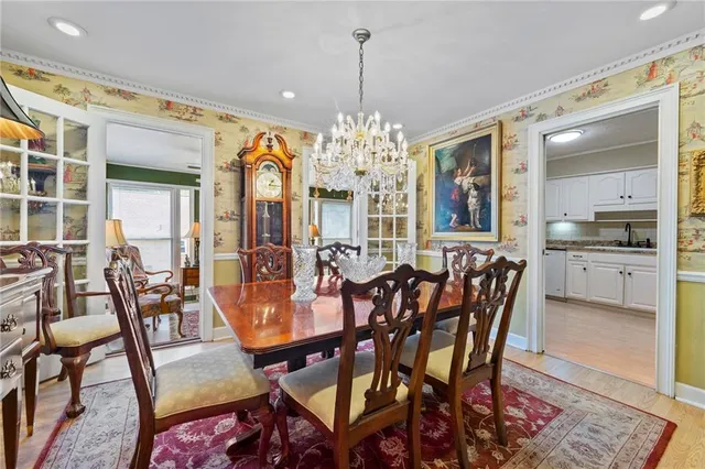 a view of a dining room with furniture and window