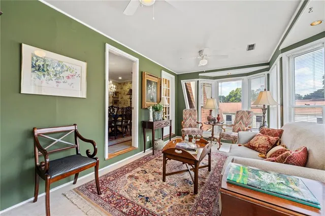 a living room with furniture and a gate