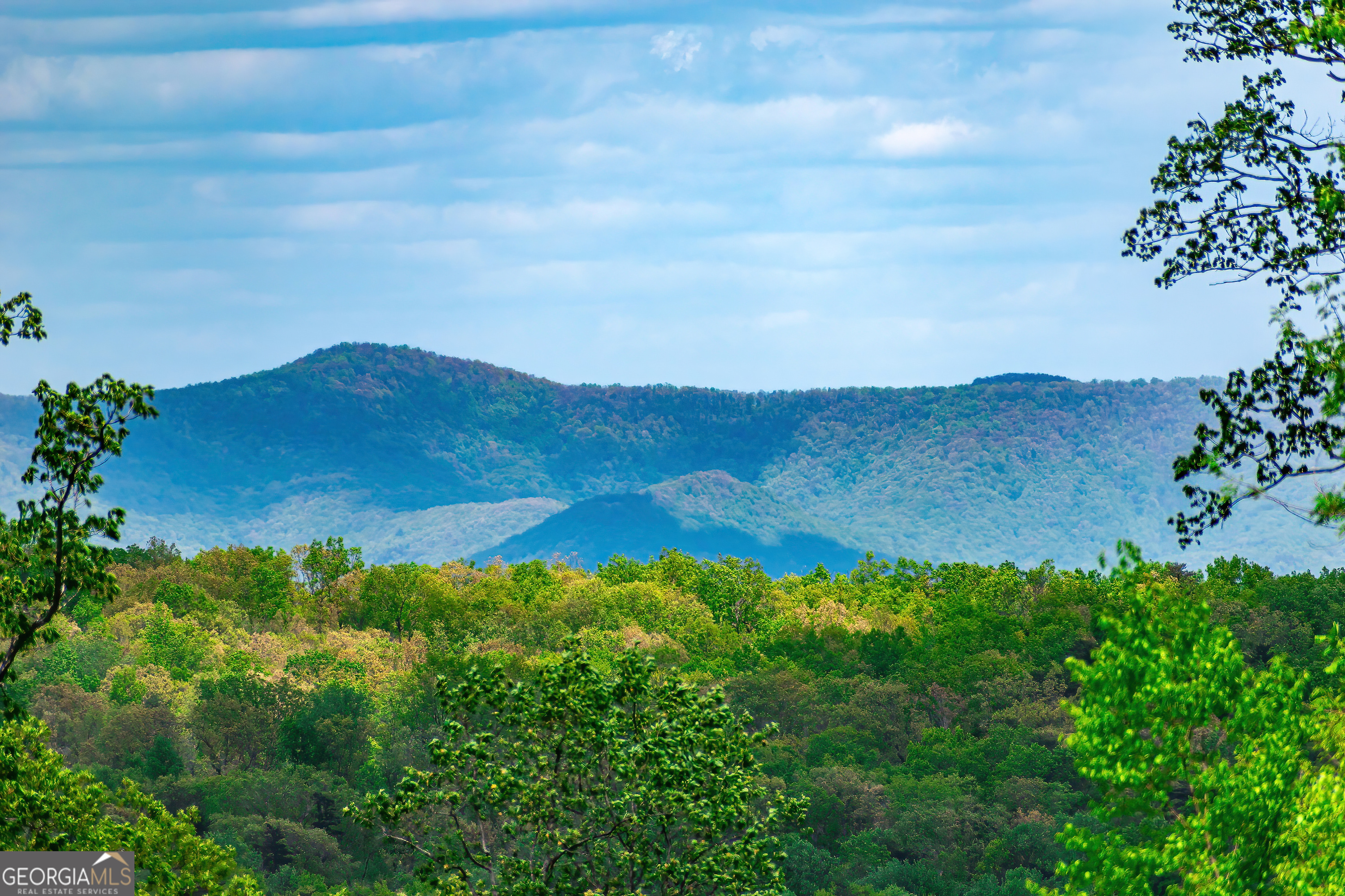 a view of mountain with outdoor space