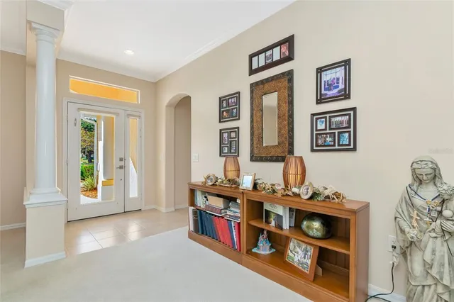 a kitchen with stainless steel appliances granite countertop a table chairs sink and cabinets