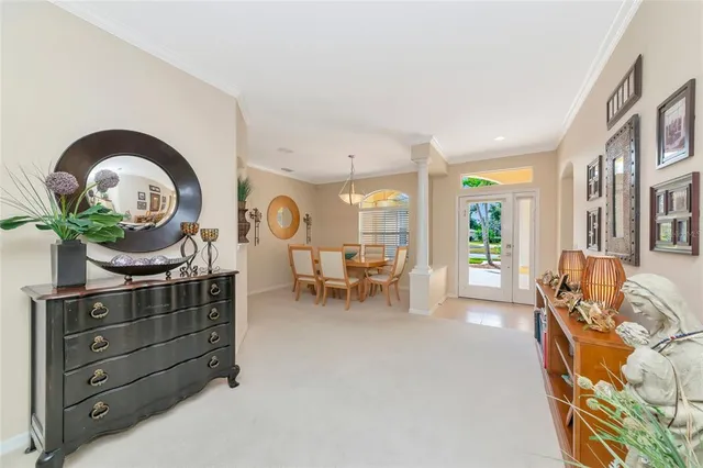 a kitchen with stainless steel appliances granite countertop white cabinets and a stove