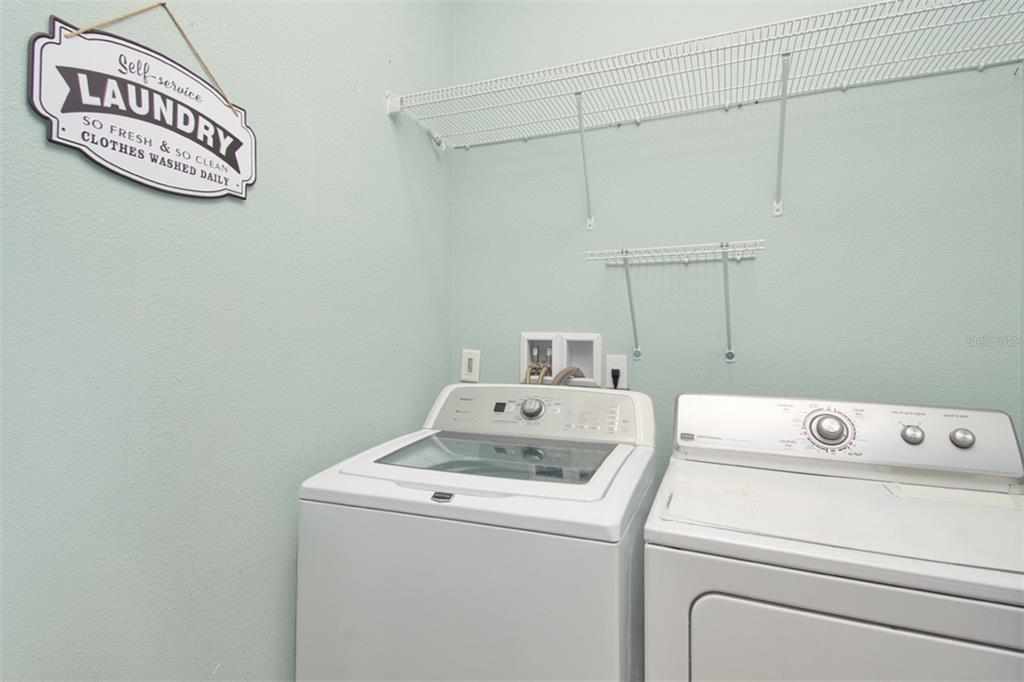 1111 Spruce Ridge Court Minneola, FL 34715 - Photo 22 of 34 a utility room with dryer and washer