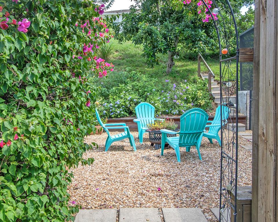 1111 Spruce Ridge Court Minneola, FL 34715 - Photo 26 of 34 a view of a chairs in a backyard