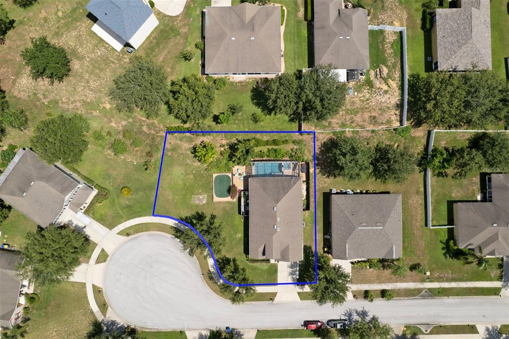 1111 Spruce Ridge Court Minneola, FL 34715 - Photo 32 of 34 an aerial view of a house with outdoor space