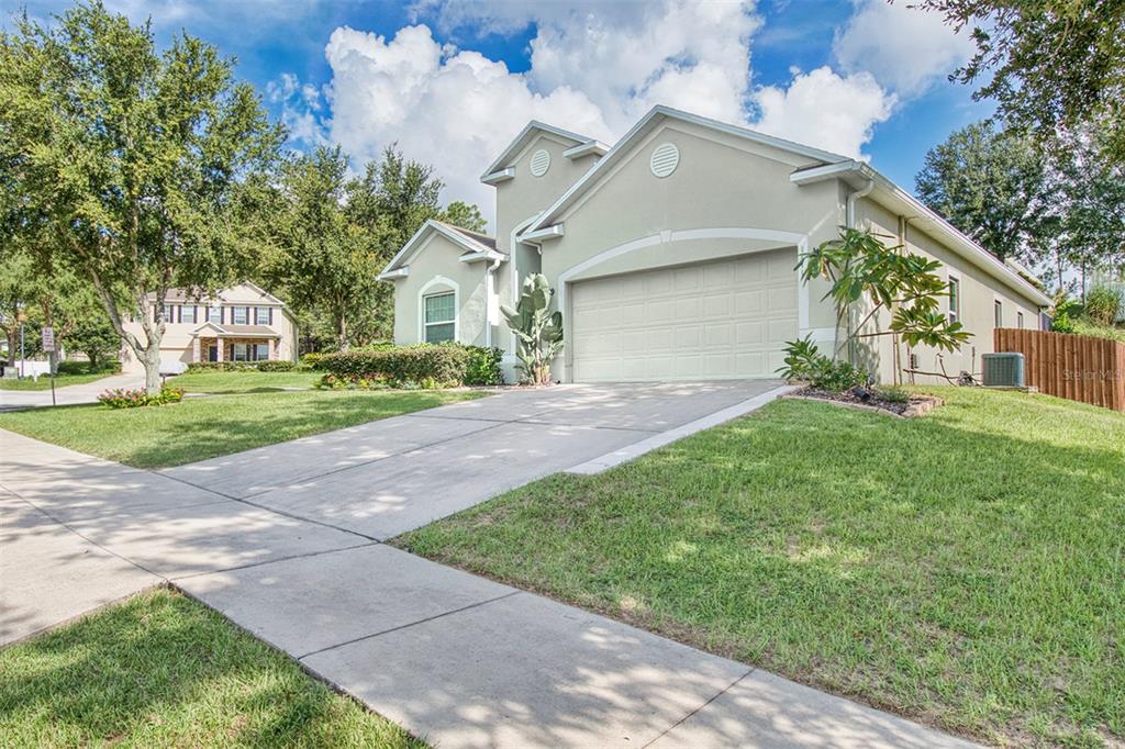 1111 Spruce Ridge Court Minneola, FL 34715 - Photo 34 of 34 a view of a house with a yard
