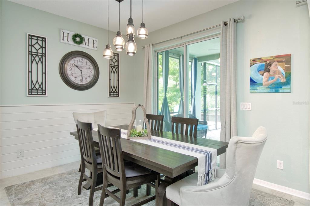 1111 Spruce Ridge Court Minneola, FL 34715 - Photo 8 of 34 a view of a dining table and chairs in a room