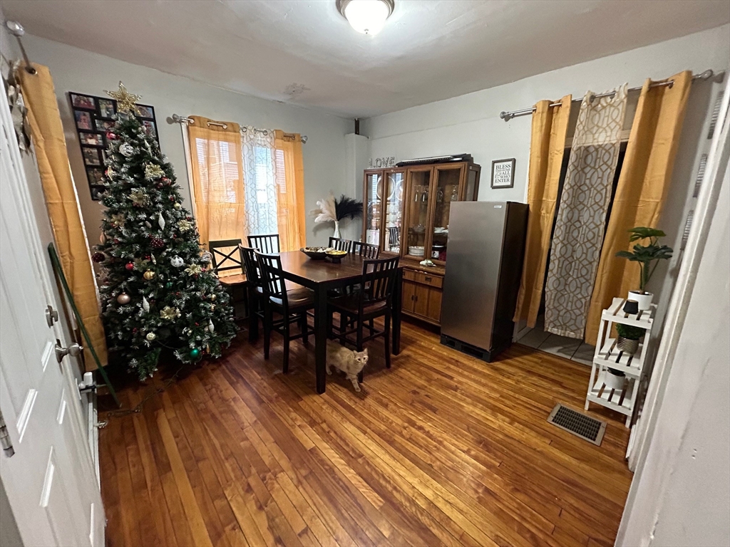 7 Bluff Street Worcester, MA 01610 - Photo 4 of 11 a view of a dining room with furniture window and wooden floor