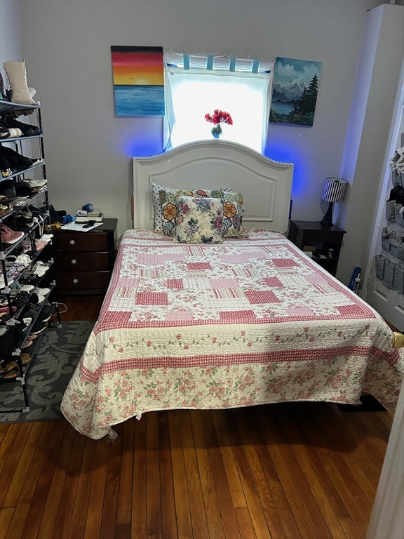 7 Bluff Street Worcester, MA 01610 - Photo 8 of 11 a bedroom with a bed and a window