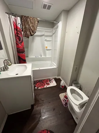 a bathroom with a sink toilet and shower