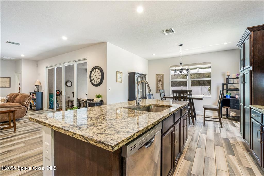 Undisclosed Address Vero Beach, FL 32966 - Photo 21 of 36 a kitchen with granite countertop kitchen island stainless steel appliances lots of counter top space