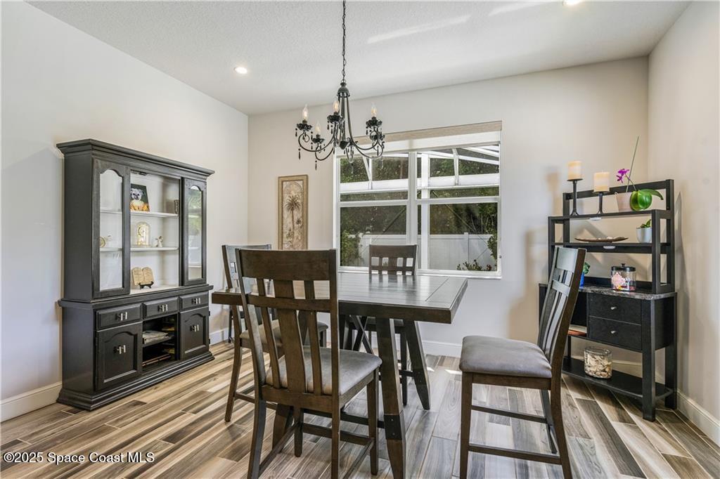 Undisclosed Address Vero Beach, FL 32966 - Photo 25 of 36 a dining room with furniture window and wooden floor