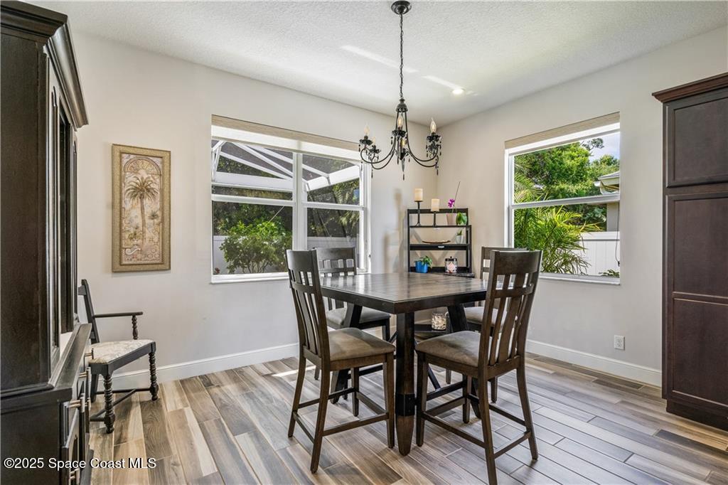 Undisclosed Address Vero Beach, FL 32966 - Photo 26 of 36 a view of a dining room with furniture window and wooden floor