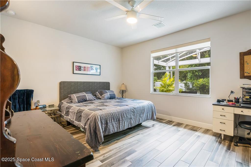 Undisclosed Address Vero Beach, FL 32966 - Photo 27 of 36 a bedroom with a bed and a desk