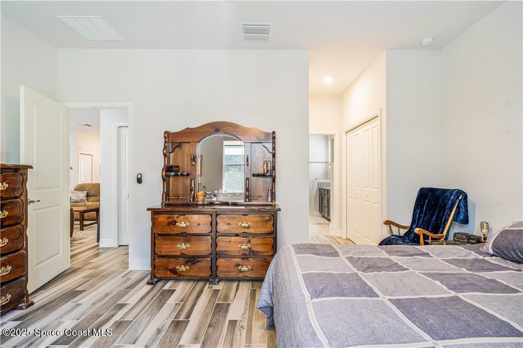 Undisclosed Address Vero Beach, FL 32966 - Photo 29 of 36 a view of living room filled with furniture and wooden floor