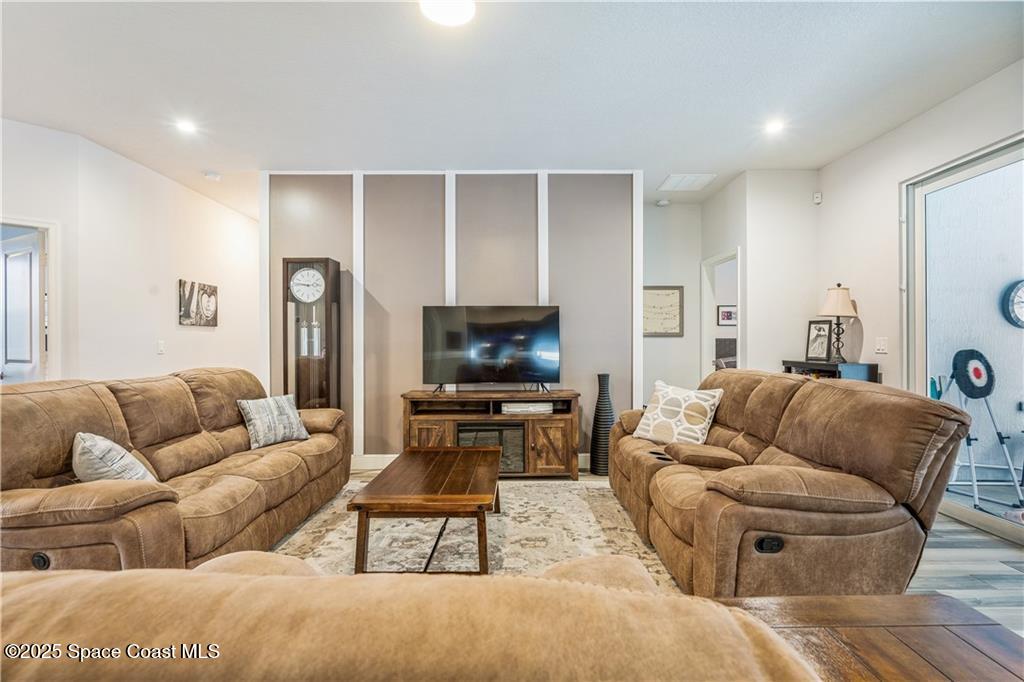 Undisclosed Address Vero Beach, FL 32966 - Photo 7 of 36 a living room with furniture and a flat screen tv